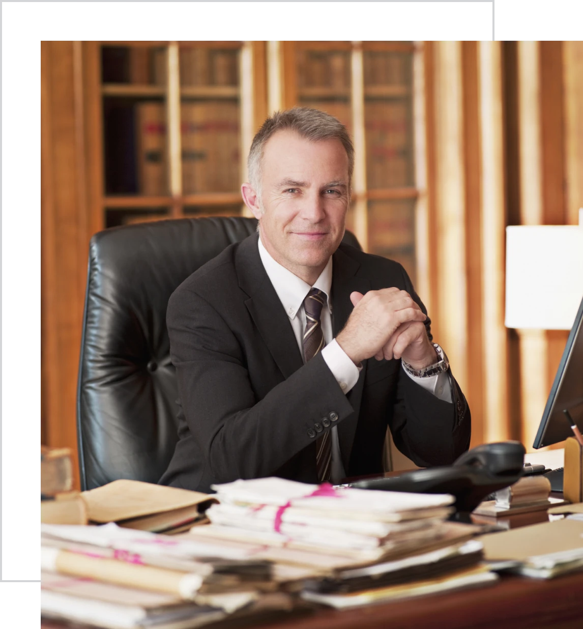 Man in suit sitting at office desk