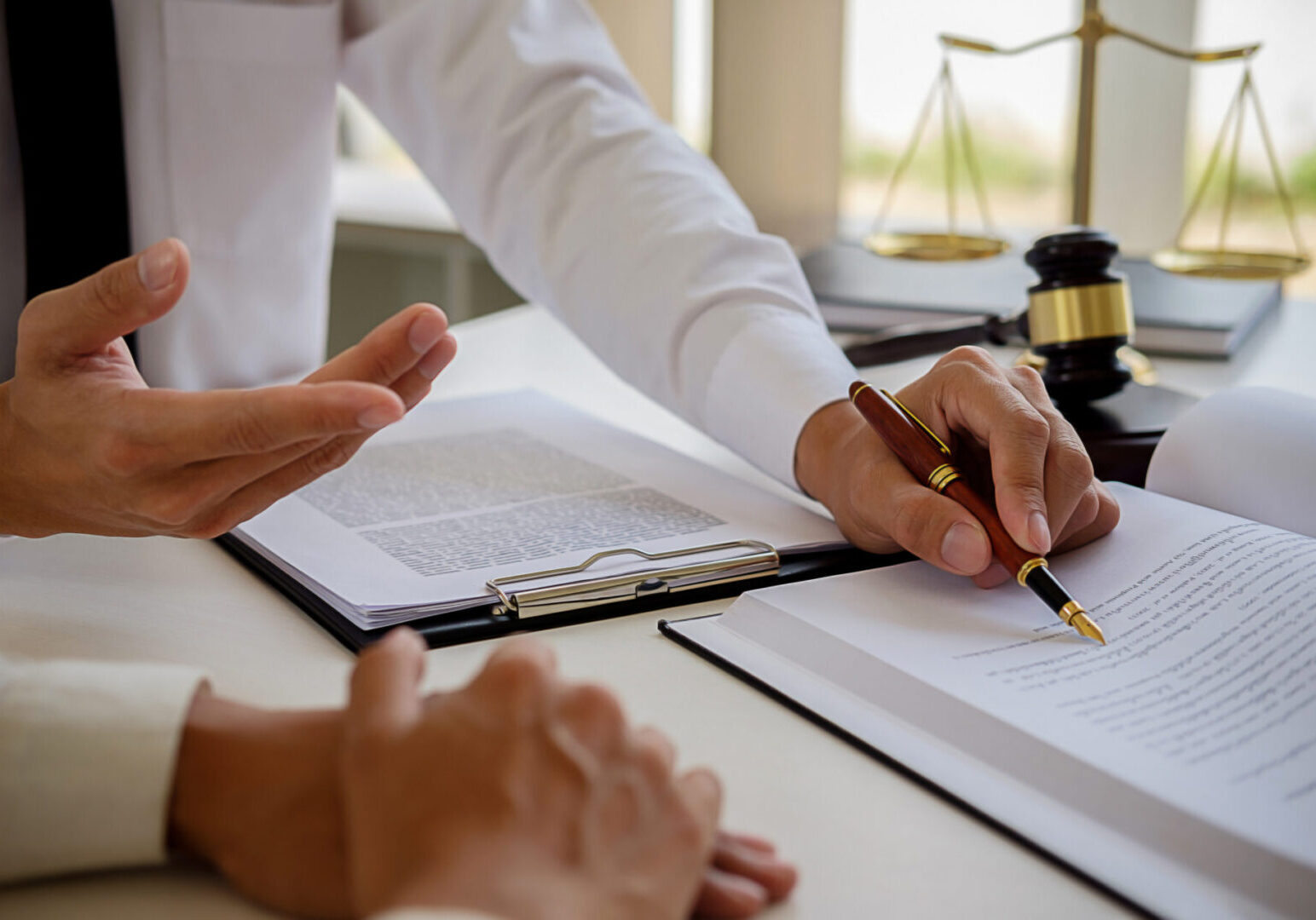 Attorney reviewing paperwork with client