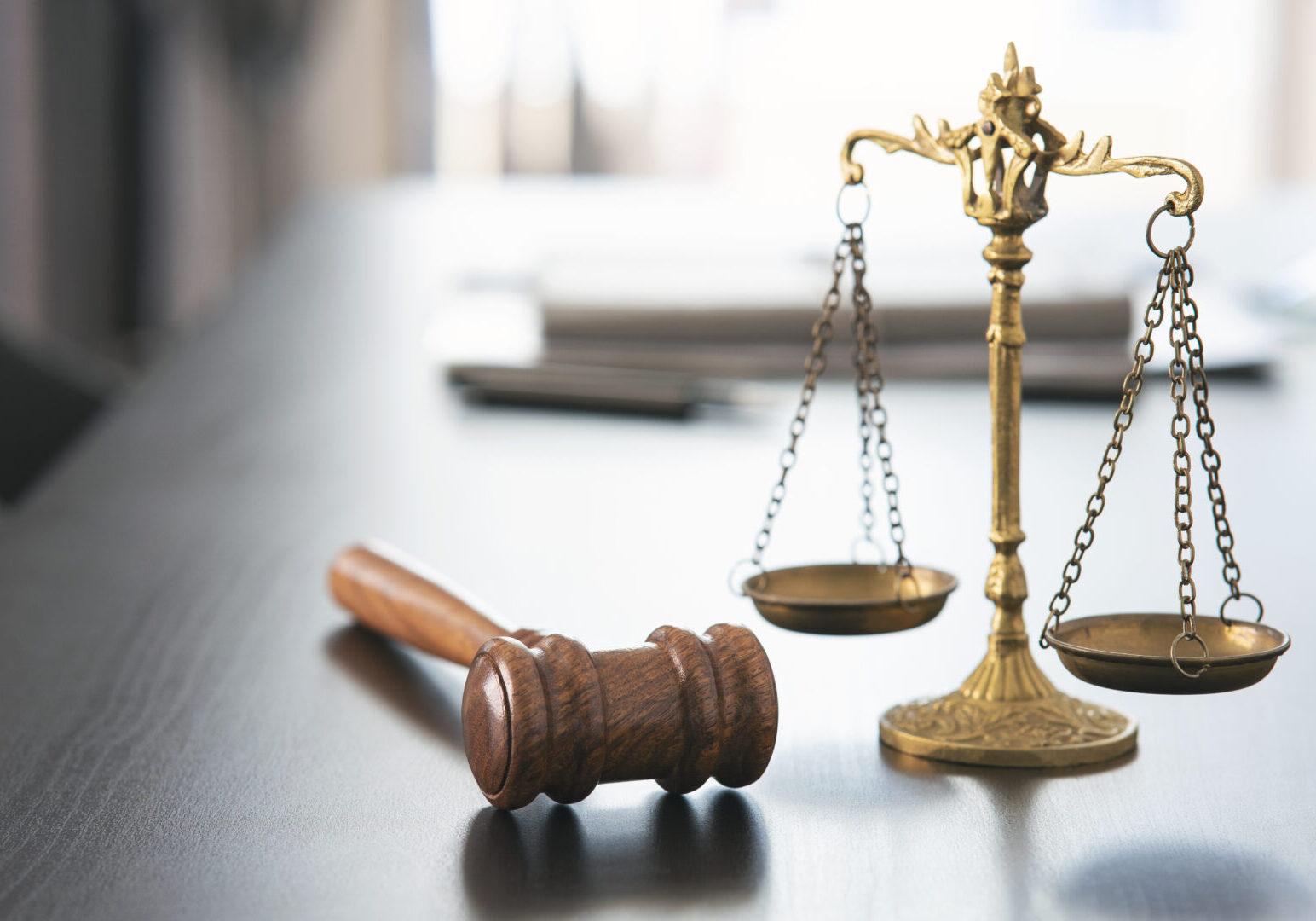 Gavel and scales of justice on table